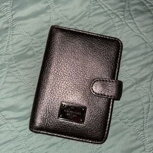 Michael Kors. Silver grey holder. Used. Good shape.